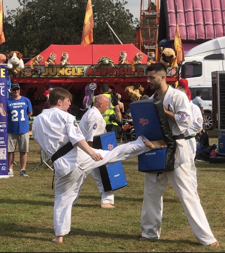 Close up of a black belt and karate gi